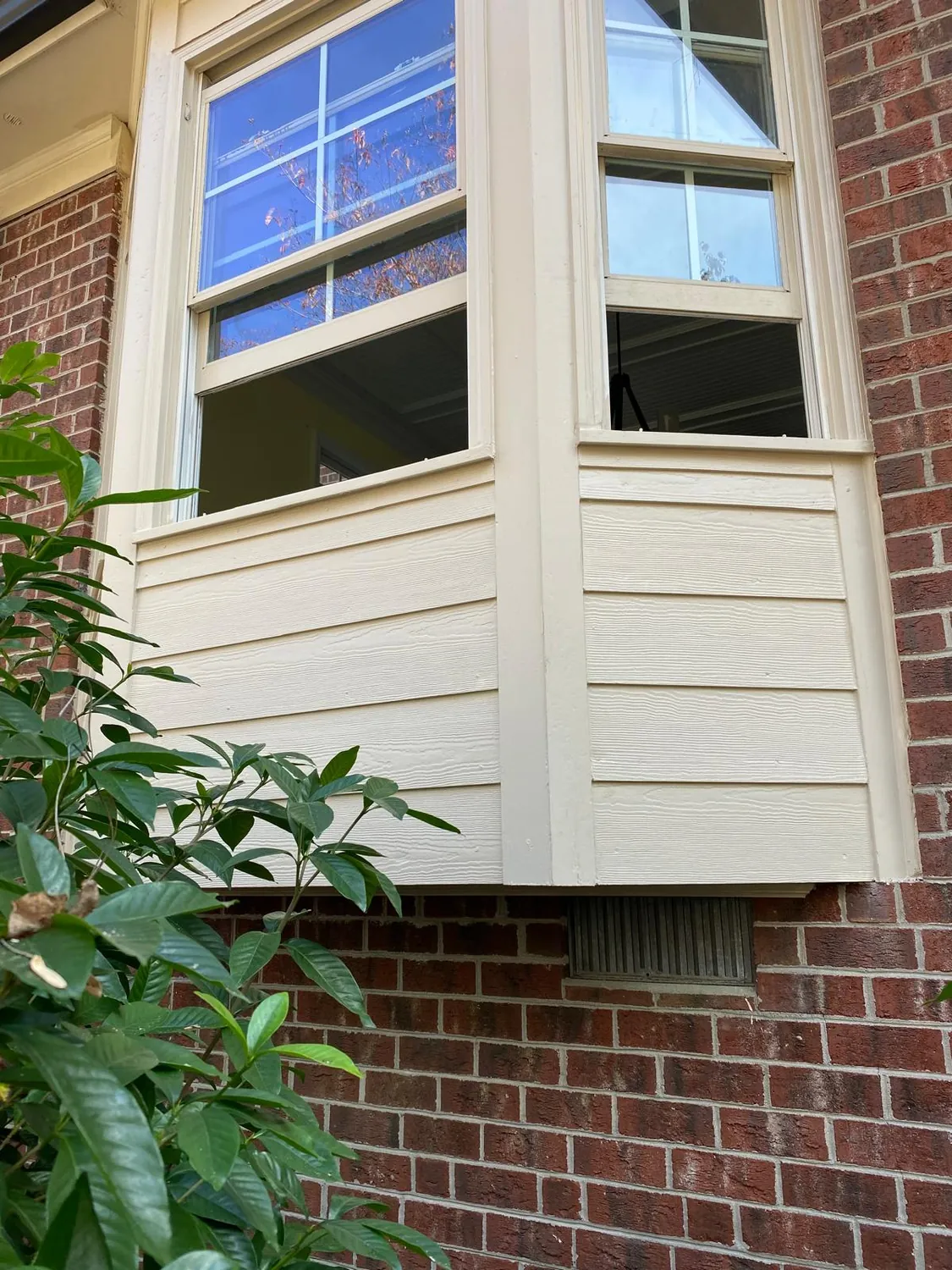 Gutter and downspout returned tight to the brick and siding